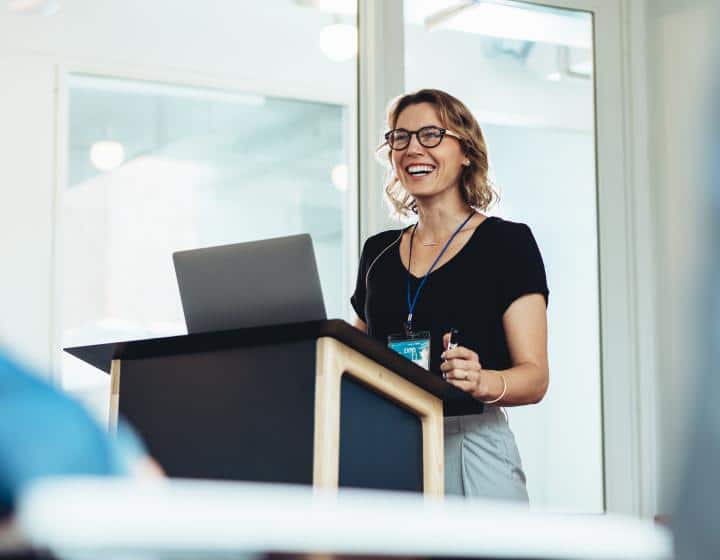 Woman standing at podium.